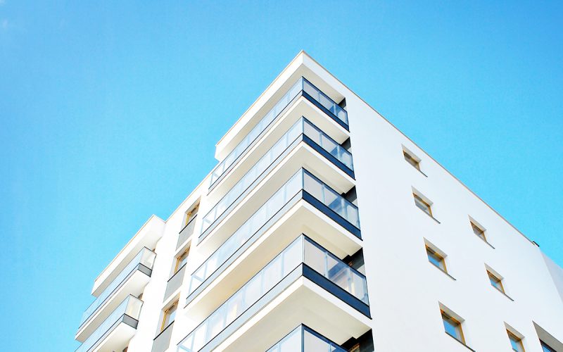 Modern apartment buildings on a sunny day with a blue sky. Facad